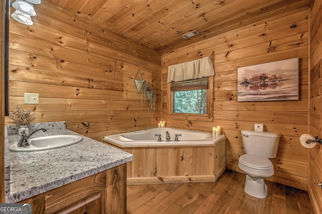 full bathroom with a garden tub, toilet, wood ceiling, wood walls, and hardwood / wood-style floors