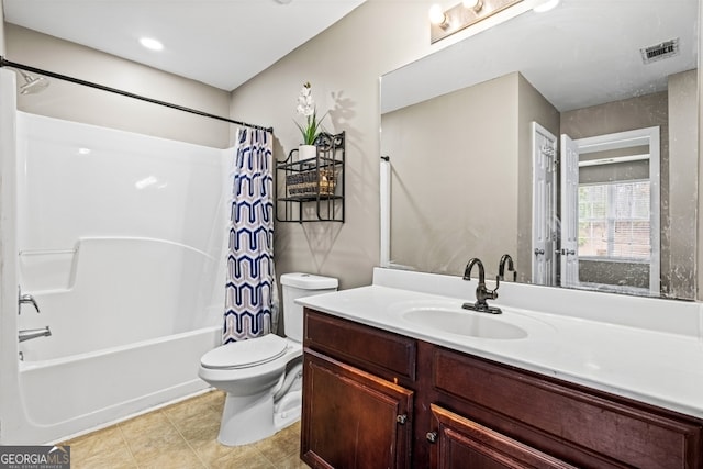 bathroom featuring visible vents, vanity, toilet, and shower / tub combo with curtain