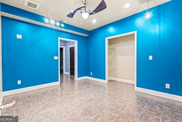 empty room featuring ceiling fan, recessed lighting, visible vents, and baseboards