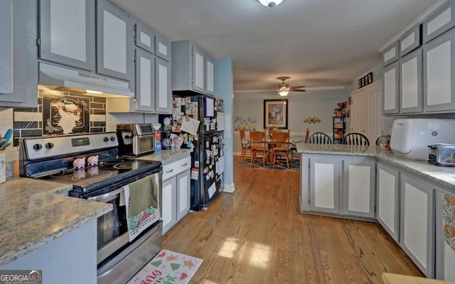 kitchen with gray cabinets, electric range, decorative backsplash, light wood-type flooring, and under cabinet range hood