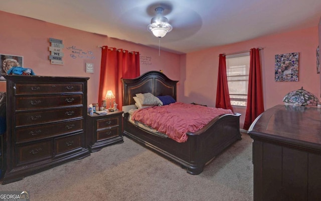 bedroom featuring a ceiling fan and light carpet