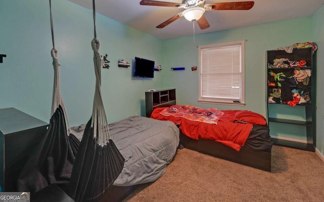 carpeted bedroom with a ceiling fan