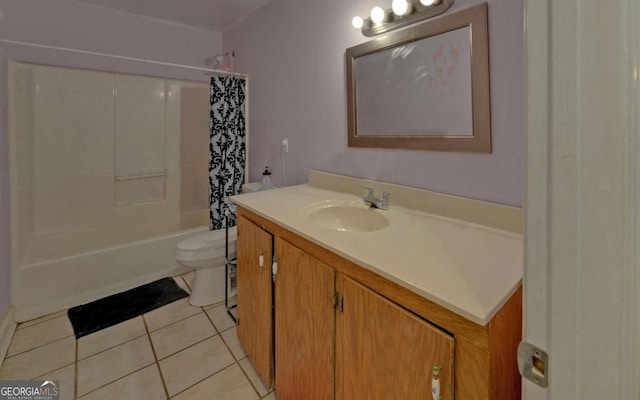 bathroom featuring shower / bath combo with shower curtain, vanity, toilet, and tile patterned floors