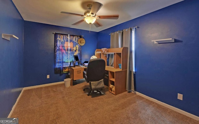 office space with carpet floors, ceiling fan, and baseboards