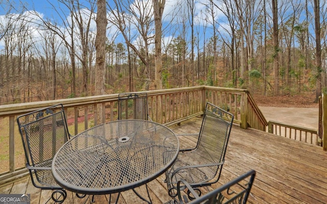 deck with outdoor dining area