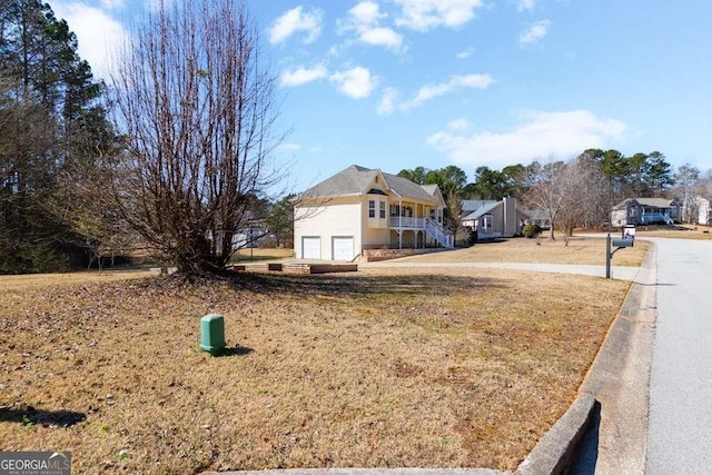 view of front of property with a garage and a front yard