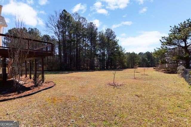 view of yard with a wooden deck