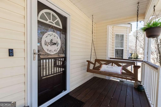 entrance to property featuring covered porch