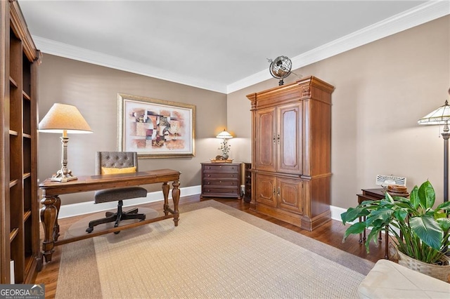 office area with crown molding, baseboards, and wood finished floors