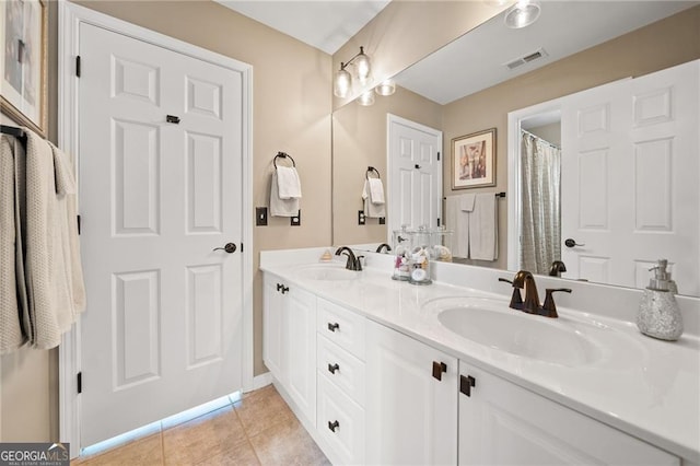 carpeted bedroom featuring visible vents and baseboards