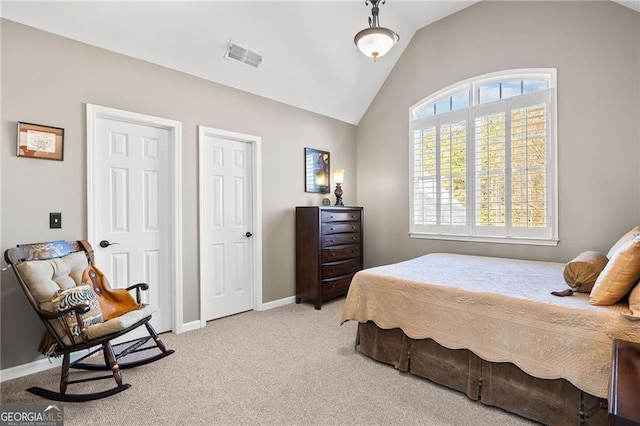 bedroom featuring multiple windows, carpet, and baseboards