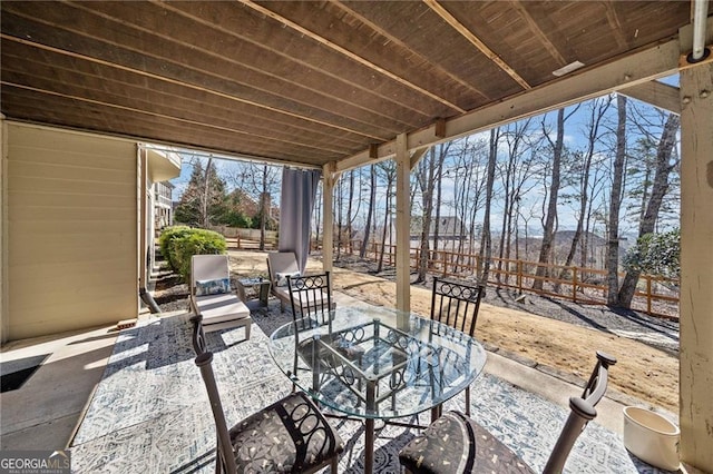 view of patio featuring fence