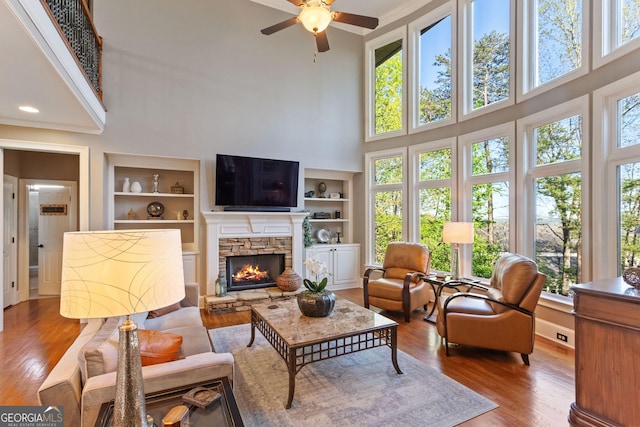 dining room featuring recessed lighting, crown molding, ornate columns, and wood finished floors