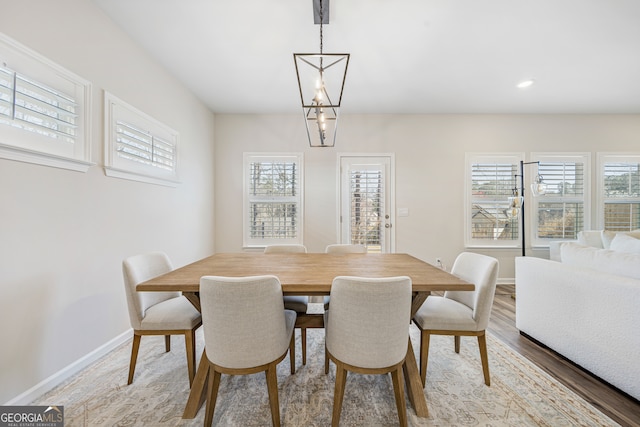 dining area with recessed lighting, plenty of natural light, baseboards, and light wood-type flooring