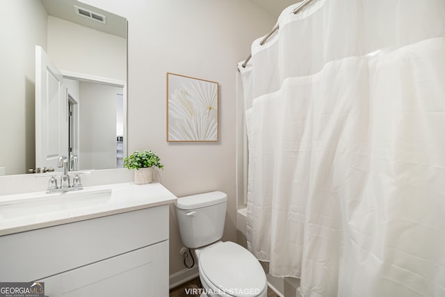 bathroom featuring visible vents, toilet, vanity, and shower / bathtub combination with curtain