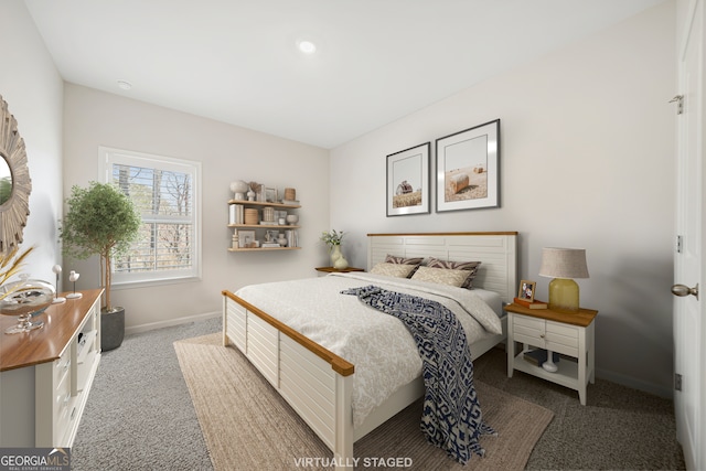 bedroom featuring baseboards and carpet