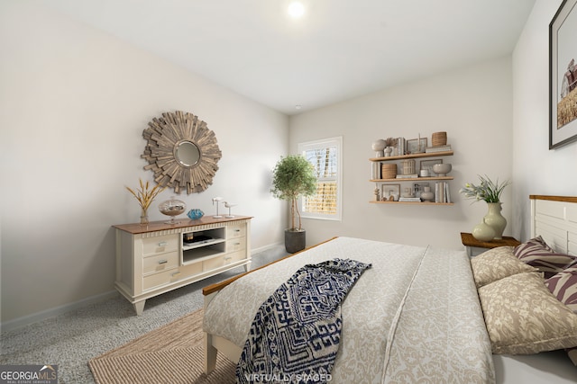 carpeted bedroom featuring baseboards