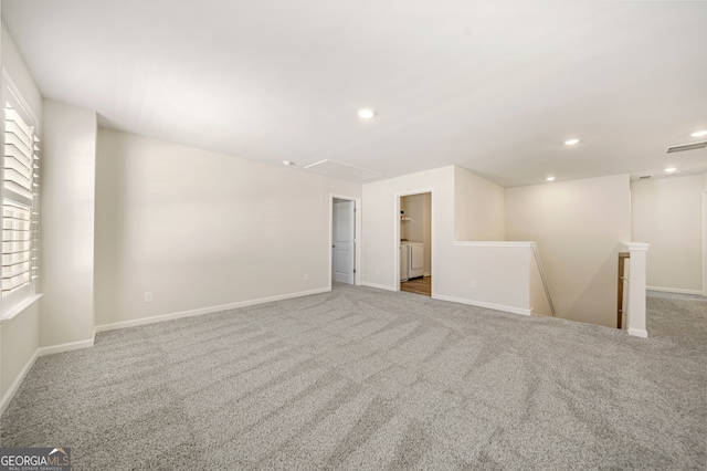 spare room with recessed lighting, washer / clothes dryer, carpet, and attic access