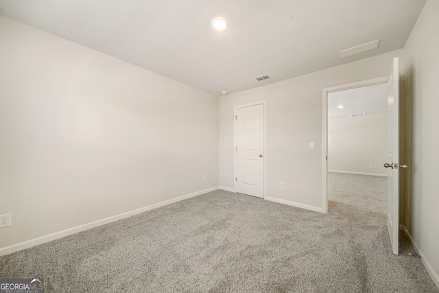 unfurnished bedroom featuring visible vents, baseboards, and carpet floors