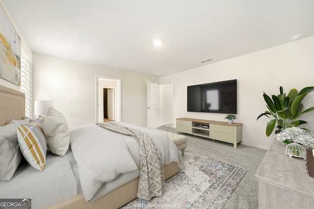 carpeted bedroom featuring baseboards