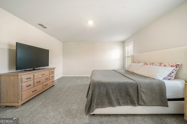 bedroom featuring light colored carpet, visible vents, and baseboards