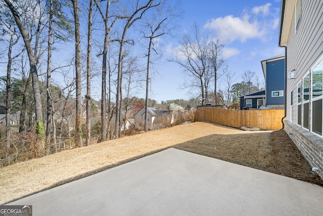 view of yard featuring a patio and fence