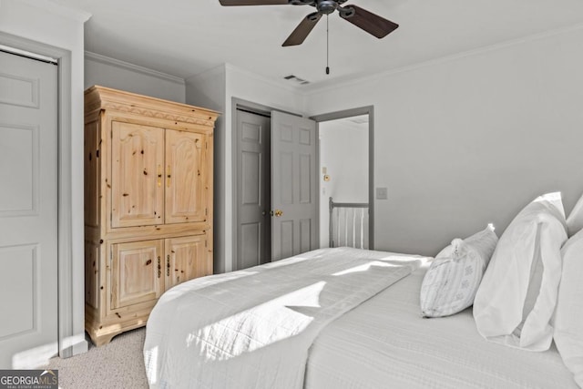 bedroom featuring a ceiling fan, visible vents, and crown molding