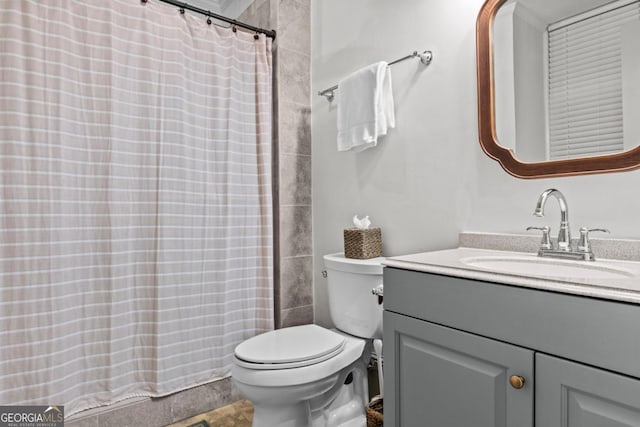 full bathroom featuring toilet and vanity