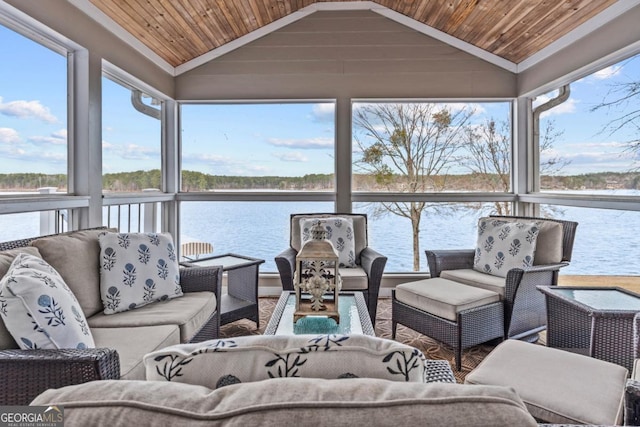 sunroom / solarium with vaulted ceiling, a water view, and wood ceiling