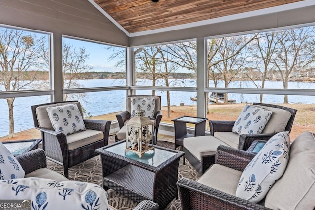 sunroom featuring plenty of natural light, wooden ceiling, and vaulted ceiling