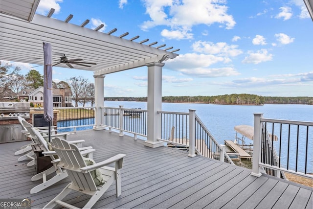 wooden deck featuring a water view, area for grilling, and a pergola