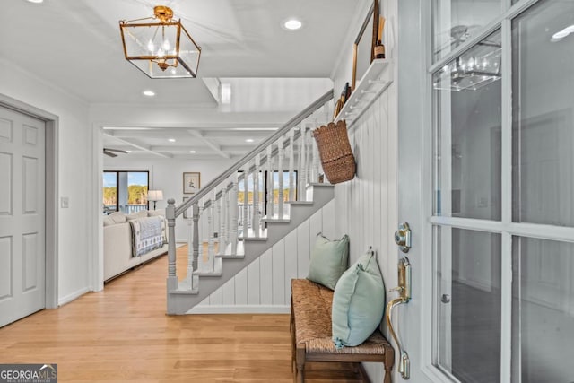 foyer entrance featuring beam ceiling, recessed lighting, stairway, wood finished floors, and coffered ceiling