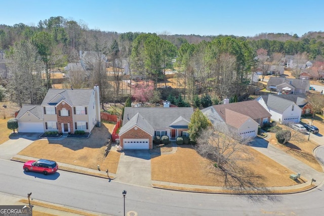 birds eye view of property with a residential view