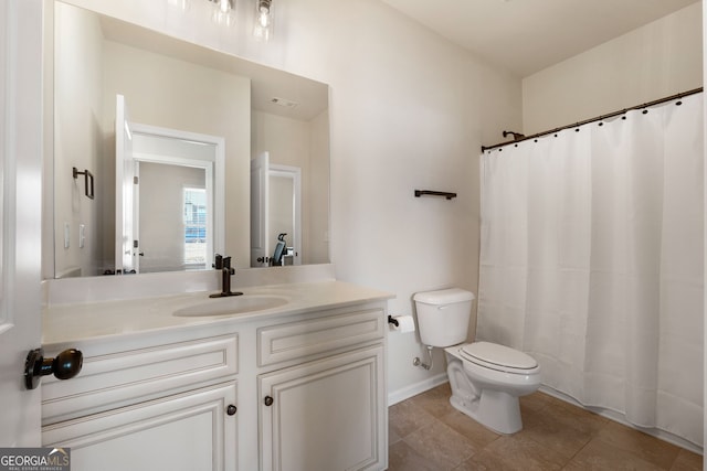 bathroom with tile patterned flooring, toilet, visible vents, vanity, and baseboards