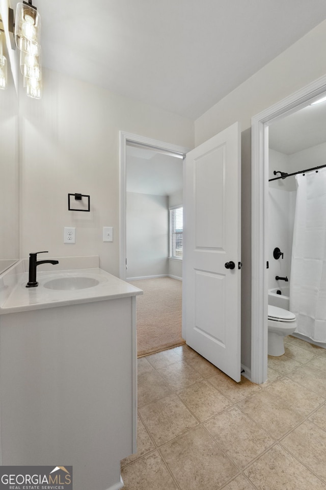 bathroom featuring toilet, shower / bathtub combination with curtain, and vanity