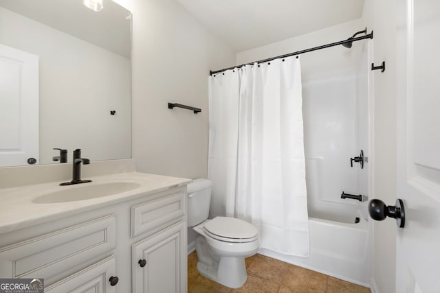 bathroom featuring tile patterned flooring, vanity, toilet, and shower / bath combo with shower curtain