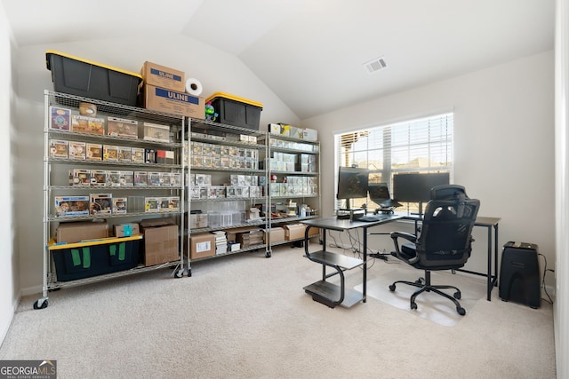 office featuring vaulted ceiling, carpet, and visible vents