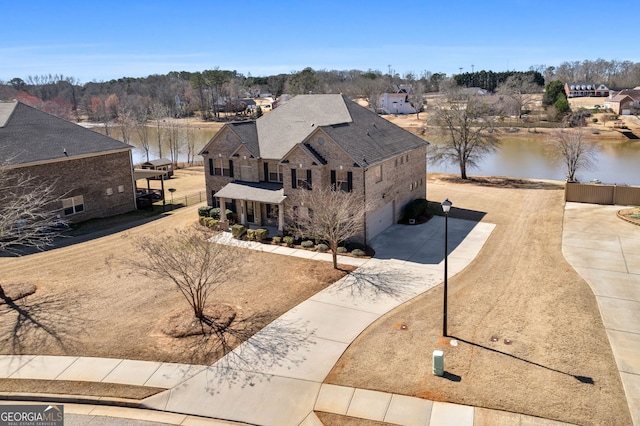 drone / aerial view with a water view