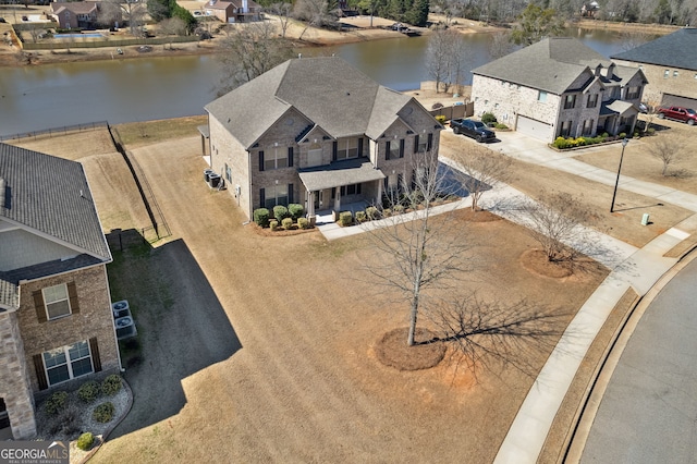 aerial view featuring a residential view and a water view