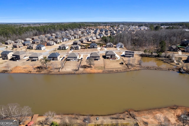 bird's eye view with a water view and a residential view