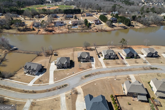 bird's eye view with a water view and a residential view