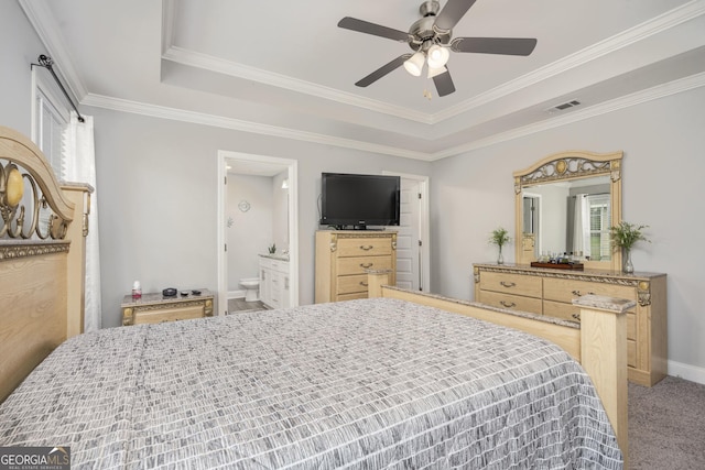 bedroom featuring carpet floors, multiple windows, visible vents, and a raised ceiling