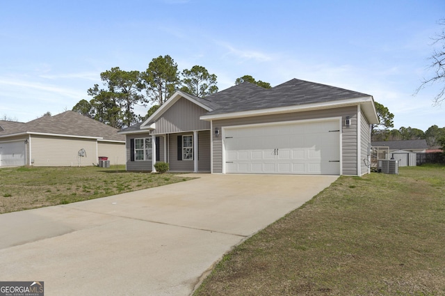 single story home featuring a garage, central air condition unit, a front lawn, and concrete driveway