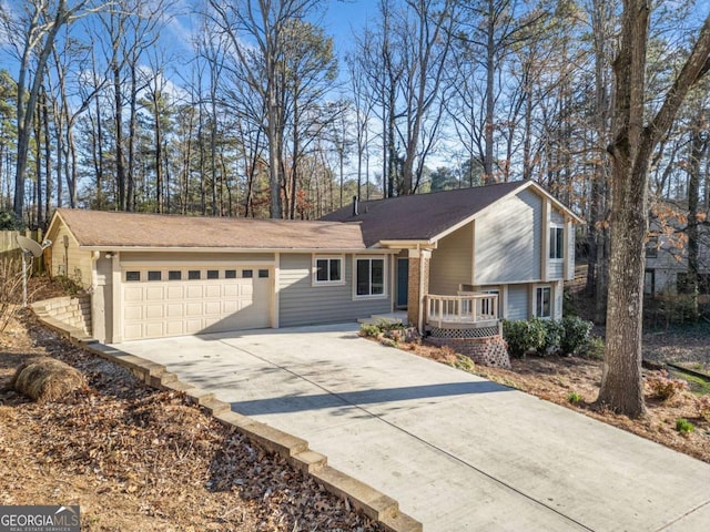 view of front of property featuring an attached garage and concrete driveway