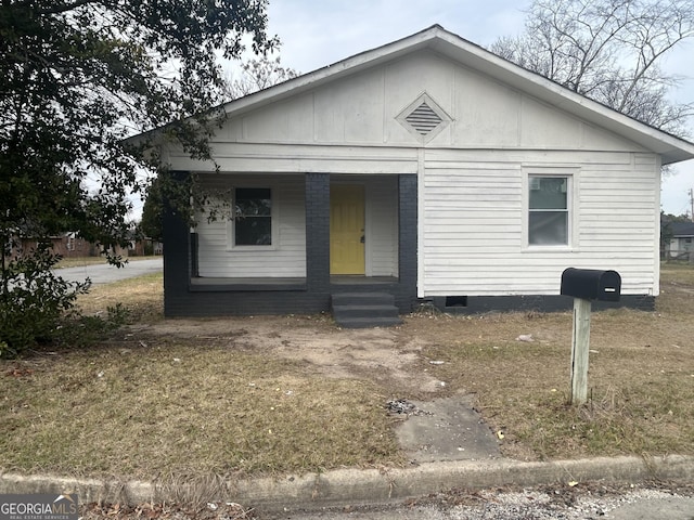 view of front of home with entry steps and crawl space