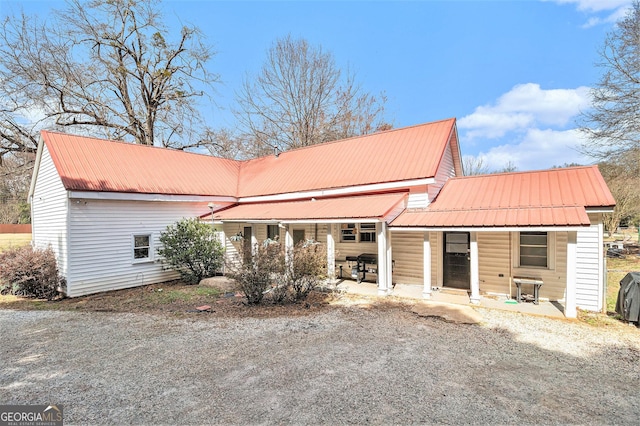 view of front of house featuring metal roof