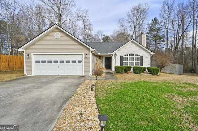 view of front of property featuring a chimney, aphalt driveway, an attached garage, fence, and a front yard