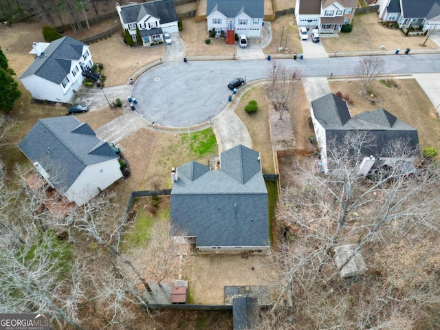 birds eye view of property with a residential view