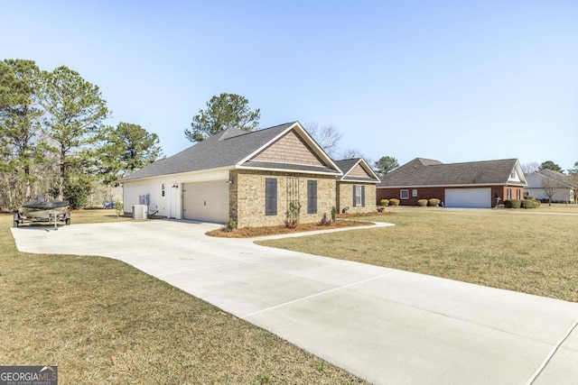 craftsman inspired home featuring brick siding, a front yard, a garage, cooling unit, and driveway