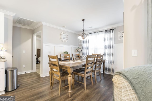 dining room featuring a chandelier, dark wood-style flooring, visible vents, and crown molding